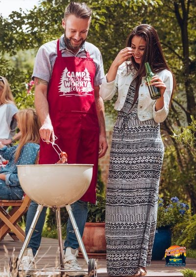 Cookout photo featuring apron with camping slogan